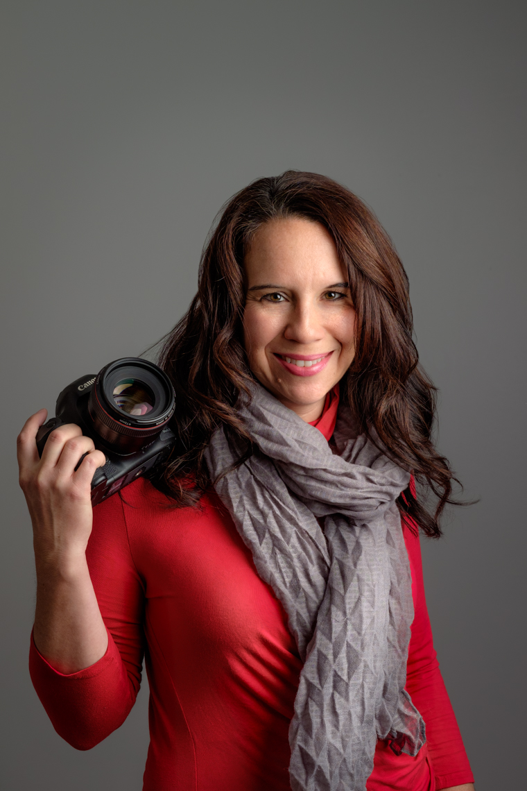 Business headshot of a female professional photographer